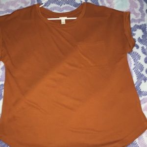 I’m selling a cute orange dress shirt.
